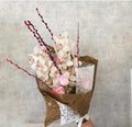 Cymbidium orchid with roses