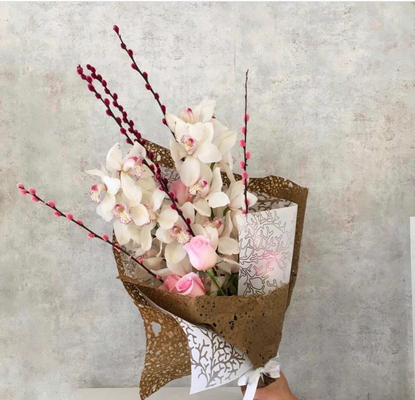 Cymbidium orchid with roses